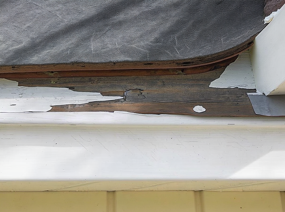 Rotted fascia board and soffit damage discovered during roofing inspection in Prichard, Mobile County, Alabama. Extended exposure to Gulf Coast moisture and failed drip edge systems require immediate attention from licensed roofing contractor to prevent structural compromise