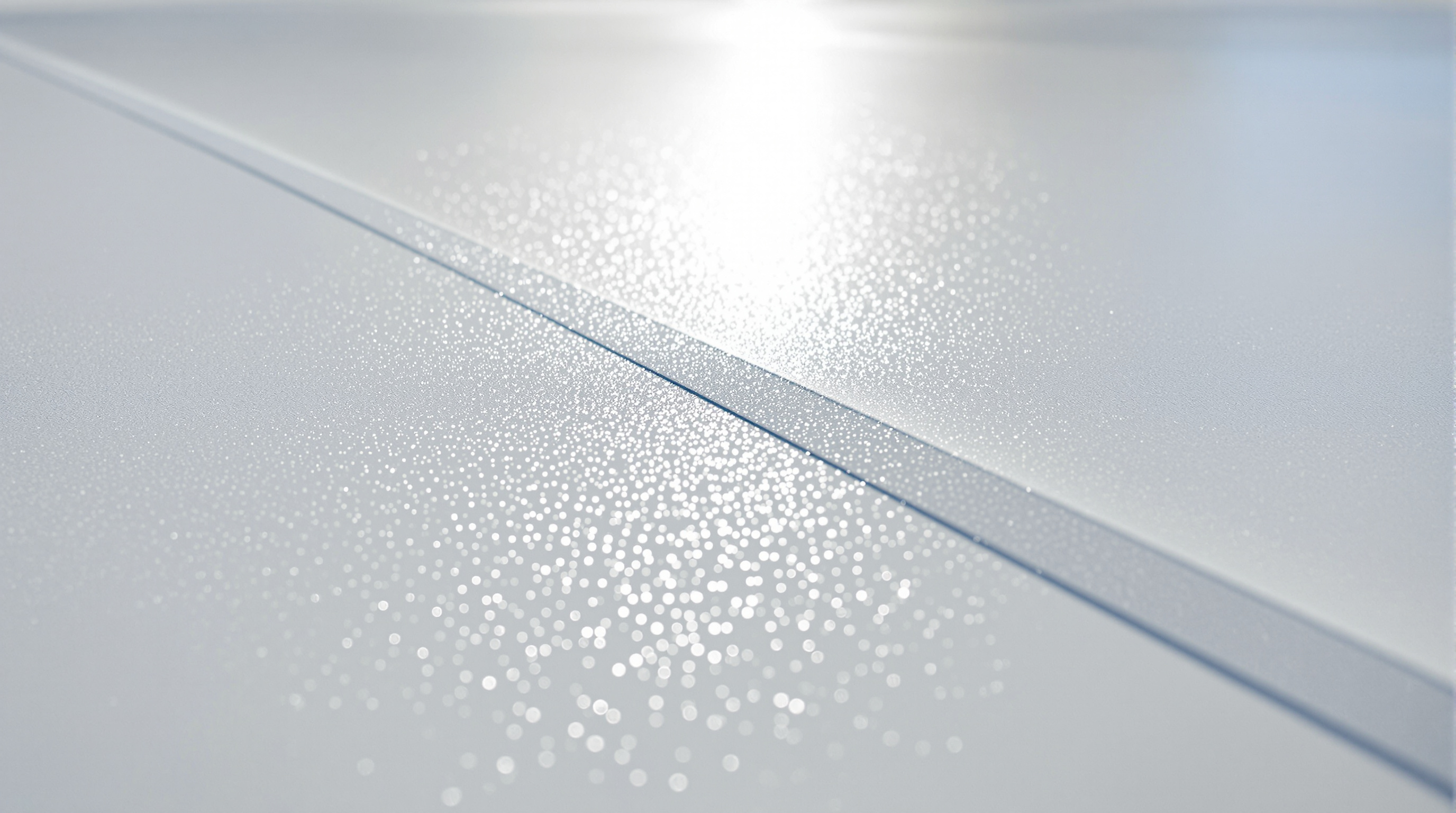 Detailed view of a white reflective TPO membrane surface on a Gulf Coast commercial building showing the thermoplastic polyolefin material that resists salt air corrosion in Baldwin County coastal markets, with the 60-mil thickness providing extended UV degradation resistance at South Alabama latitude where solar intensity exceeds national averages for commercial roofing applications